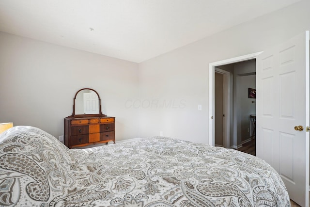 bedroom with wood finished floors