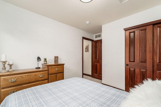 bedroom featuring light carpet and visible vents