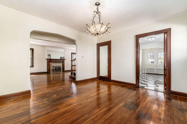 629 Hilltonia Ave, Columbus, OH 43223 - interior space with arched walkways, hardwood / wood-style floors, crown molding, and baseboards