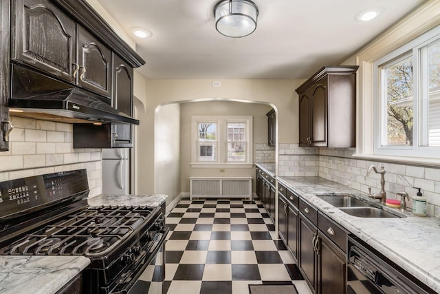 629 Hilltonia Ave, Columbus, OH 43223 - kitchen featuring radiator, dark floors, a sink, arched walkways, and black appliances