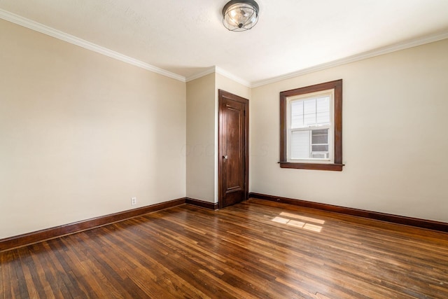 629 Hilltonia Ave, Columbus, OH 43223 - spare room featuring baseboards, dark wood-style flooring, and crown molding