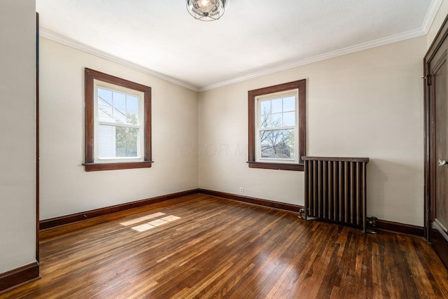 629 Hilltonia Ave, Columbus, OH 43223 - spare room featuring hardwood / wood-style flooring, baseboards, radiator heating unit, and a healthy amount of sunlight