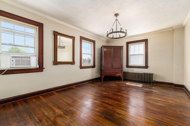 629 Hilltonia Ave, Columbus, OH 43223 - unfurnished room with a notable chandelier, wood-type flooring, a wealth of natural light, and radiator heating unit