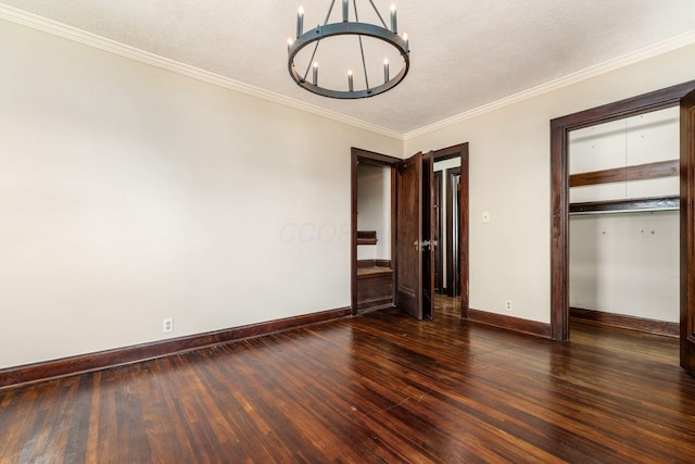 629 Hilltonia Ave, Columbus, OH 43223 - interior space with baseboards, an inviting chandelier, wood finished floors, a closet, and ornamental molding