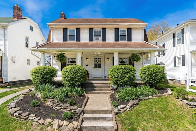 629 Hilltonia Ave, Columbus, OH 43223 - view of front of house with a porch, a chimney, and roof with shingles