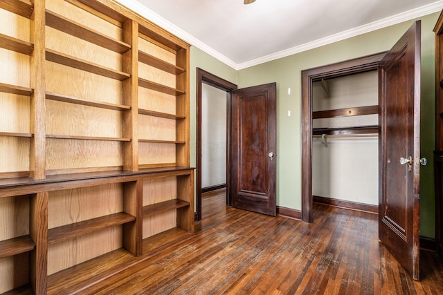 629 Hilltonia Ave, Columbus, OH 43223 - unfurnished bedroom featuring ornamental molding, baseboards, dark wood-style flooring, and a closet