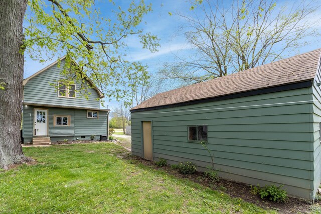 exterior space featuring a lawn and entry steps