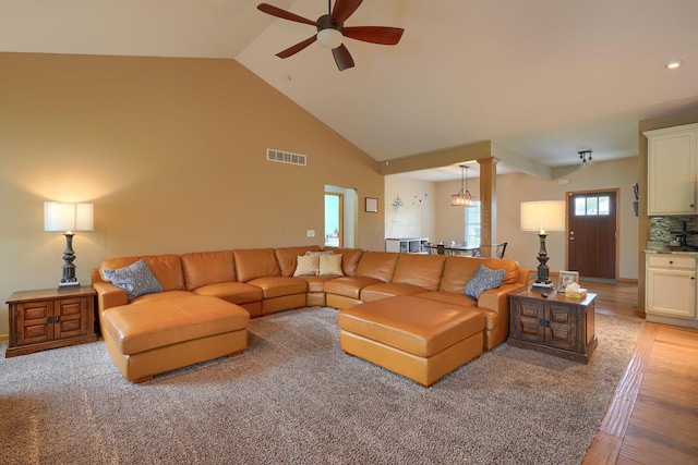 living room with recessed lighting, ceiling fan, high vaulted ceiling, light wood-type flooring, and visible vents
