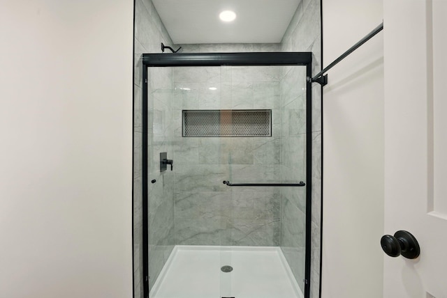 full bath with a shower stall