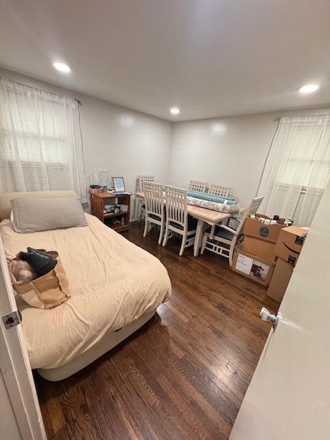 bedroom with wood finished floors and recessed lighting