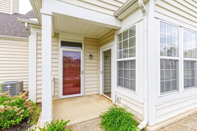 doorway to property featuring central AC