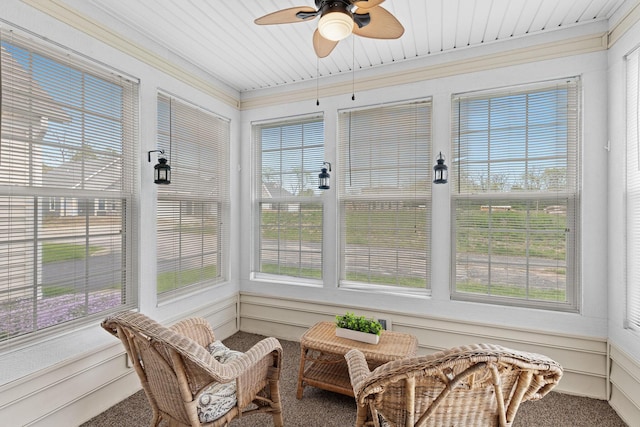 sunroom featuring carpet floors and a wealth of natural light