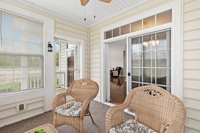 sunroom / solarium featuring ceiling fan