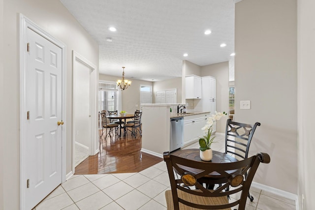 dining space featuring recessed lighting, baseboards, a notable chandelier, and light tile patterned floors