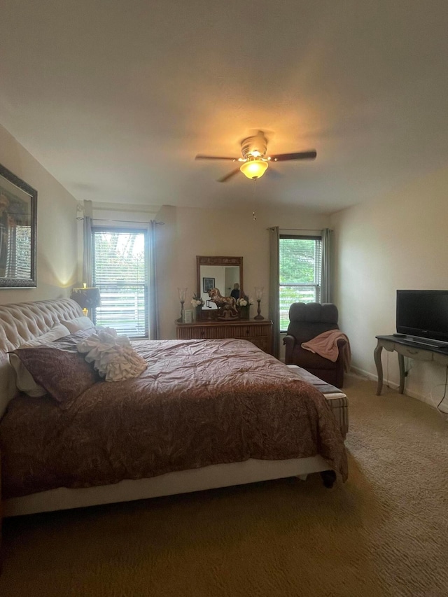 carpeted bedroom featuring a ceiling fan