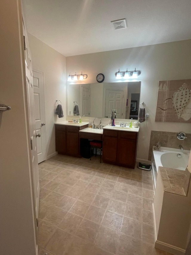 full bathroom with double vanity, visible vents, a sink, and a bath
