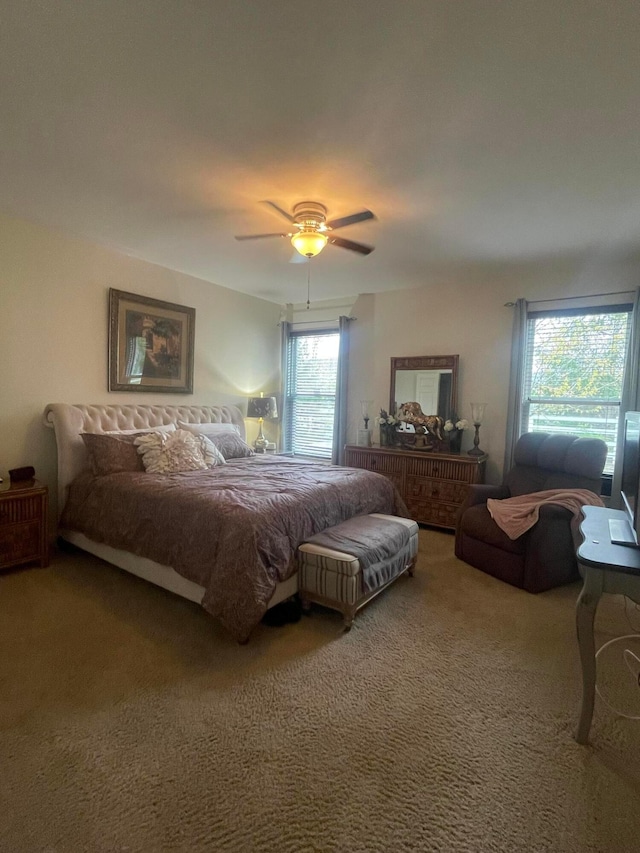 carpeted bedroom with ceiling fan