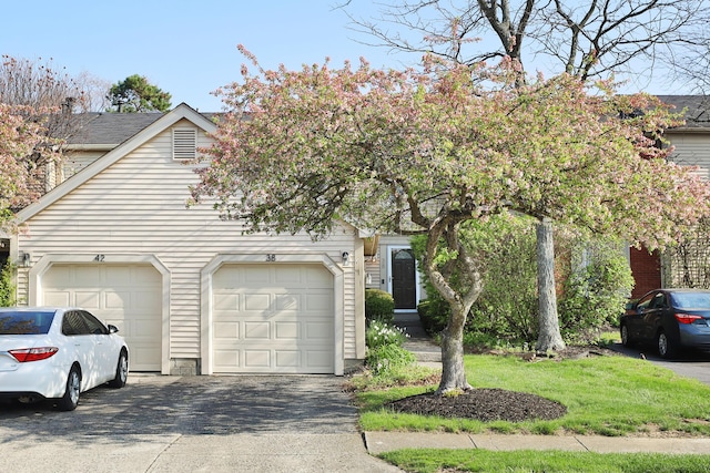 38 Ravine Ridge Dr S, Powell, OH 43065 - obstructed view of property with an attached garage and aphalt driveway