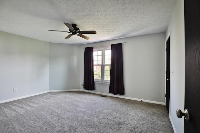 38 Ravine Ridge Dr S, Powell, OH 43065 - spare room featuring a textured ceiling, carpet floors, visible vents, and ceiling fan
