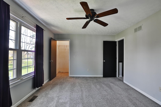 38 Ravine Ridge Dr S, Powell, OH 43065 - unfurnished bedroom with a textured ceiling, visible vents, and carpet