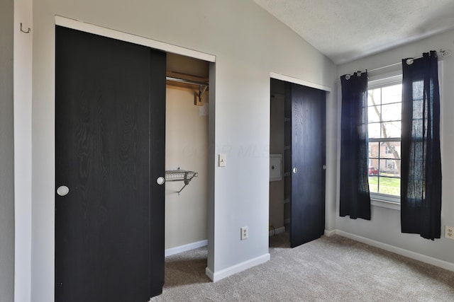 38 Ravine Ridge Dr S, Powell, OH 43065 - unfurnished bedroom with two closets, baseboards, carpet flooring, and multiple windows