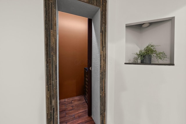 hallway with wood finished floors