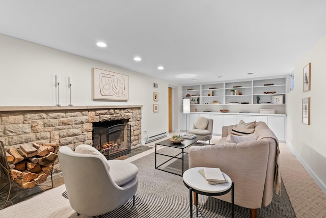 living room featuring recessed lighting, a stone fireplace, baseboard heating, baseboards, and built in shelves