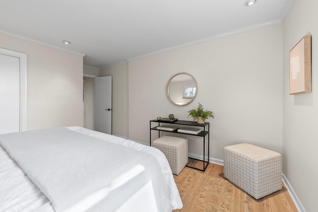 bedroom with ornamental molding, recessed lighting, baseboards, and light wood-style floors