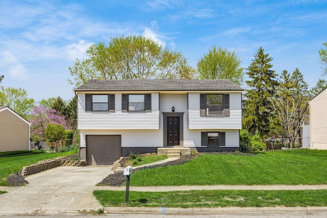 5930 Parkglen Rd, Galloway, OH 43119 - split foyer home with an attached garage, a front lawn, and concrete driveway