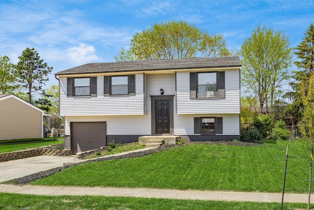5930 Parkglen Rd, Galloway, OH 43119 - split foyer home featuring a garage, a front yard, and concrete driveway