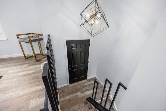 5930 Parkglen Rd, Galloway, OH 43119 - foyer entrance featuring a chandelier, wood finished floors, and baseboards