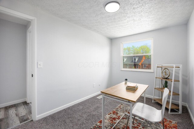 5930 Parkglen Rd, Galloway, OH 43119 - office space featuring baseboards, a textured ceiling, and carpet floors