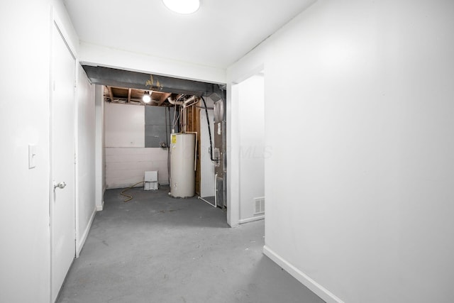 5930 Parkglen Rd, Galloway, OH 43119 - unfinished basement with baseboards, visible vents, and gas water heater