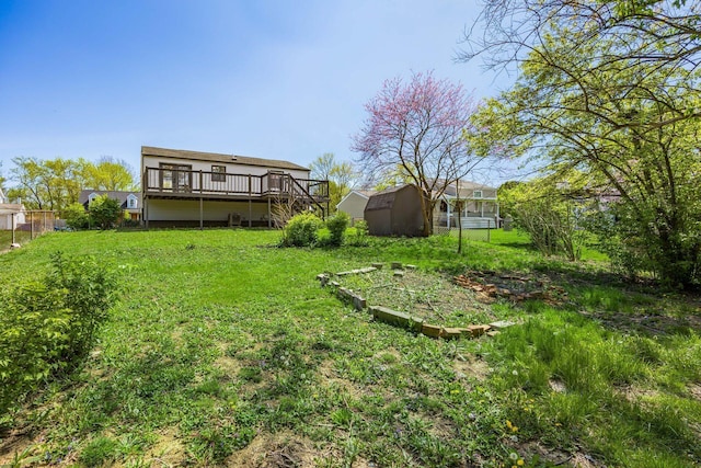 5930 Parkglen Rd, Galloway, OH 43119 - view of yard featuring stairway, fence, an outbuilding, a storage unit, and a deck