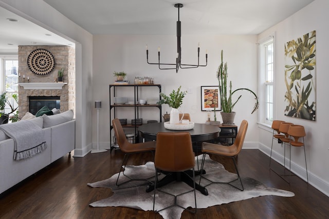 1345 Haines Ave, Columbus, OH 43212 - dining room featuring baseboards, wood finished floors, healthy amount of natural light, and a fireplace