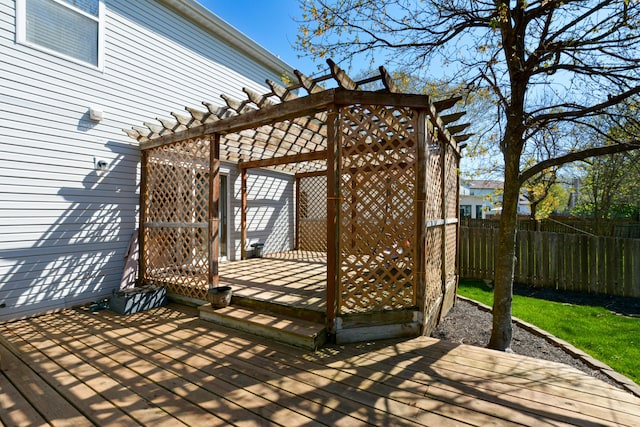 wooden terrace featuring a pergola and fence