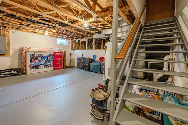 730 Erin St, Lewis Center, OH 43035 - basement with concrete block wall, electric panel, and stairs