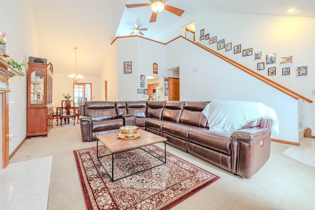 730 Erin St, Lewis Center, OH 43035 - living room with baseboards, ceiling fan with notable chandelier, light carpet, and high vaulted ceiling