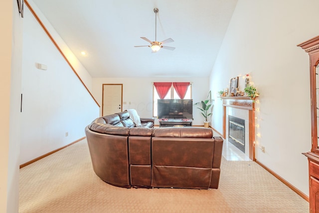 730 Erin St, Lewis Center, OH 43035 - carpeted living room featuring a fireplace with flush hearth, baseboards, vaulted ceiling, and a ceiling fan