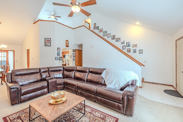 730 Erin St, Lewis Center, OH 43035 - living room featuring light tile patterned flooring, baseboards, high vaulted ceiling, light colored carpet, and ceiling fan with notable chandelier