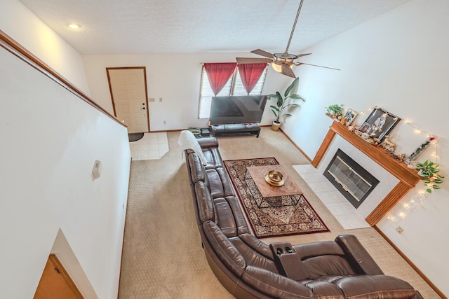 730 Erin St, Lewis Center, OH 43035 - carpeted living area featuring baseboards, ceiling fan, a fireplace, and a textured ceiling