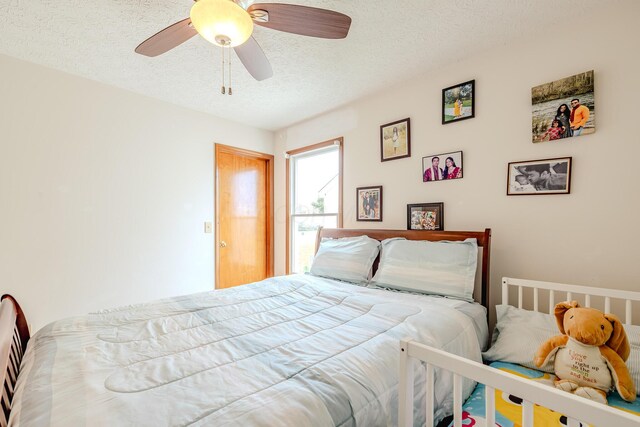 730 Erin St, Lewis Center, OH 43035 - bedroom with a ceiling fan and a textured ceiling