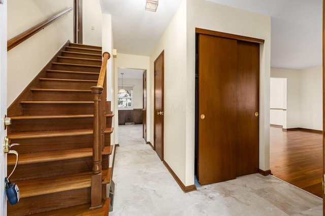 stairs featuring baseboards