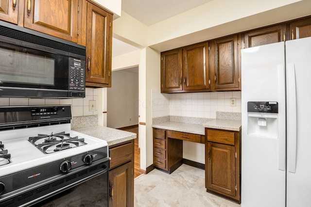 kitchen with black microwave, white fridge with ice dispenser, decorative backsplash, and gas stove