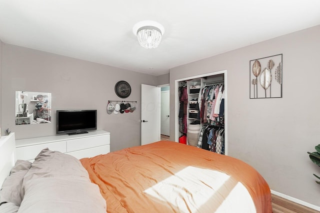 1898 Fenton St, Columbus, OH 43224 - bedroom featuring a closet, baseboards, and wood finished floors