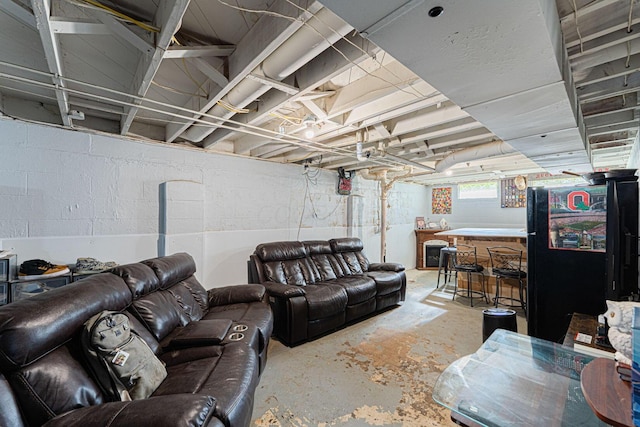 1898 Fenton St, Columbus, OH 43224 - living area featuring concrete flooring and bar