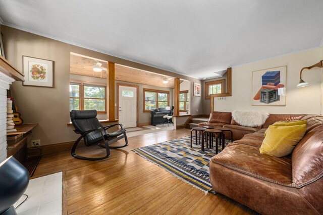1397 Glenn Ave, Columbus, OH 43212 - living room with a fireplace, wood-type flooring, ornamental molding, and baseboards