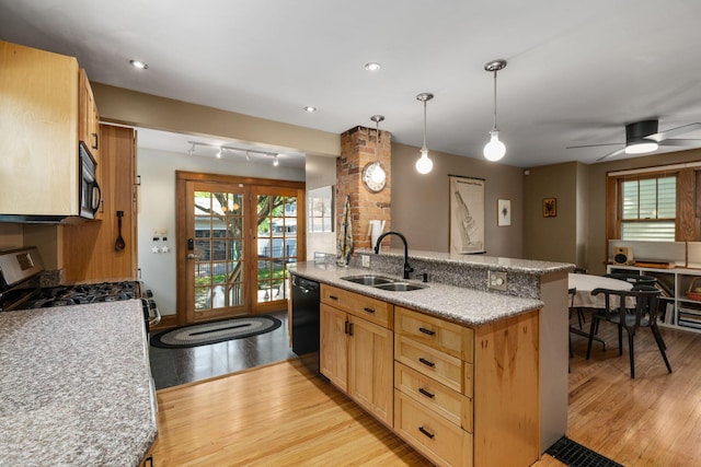 1397 Glenn Ave, Columbus, OH 43212 - kitchen with a sink, black appliances, light wood finished floors, light stone countertops, and pendant lighting