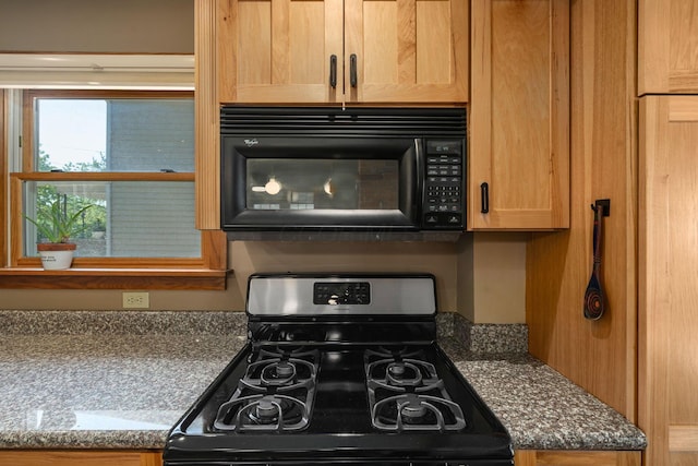 1397 Glenn Ave, Columbus, OH 43212 - kitchen view of gas stove and black microwave