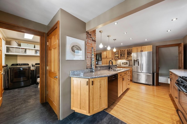 1397 Glenn Ave, Columbus, OH 43212 - kitchen with stainless steel fridge with ice dispenser, black dishwasher, stove, independent washer and dryer, and a sink